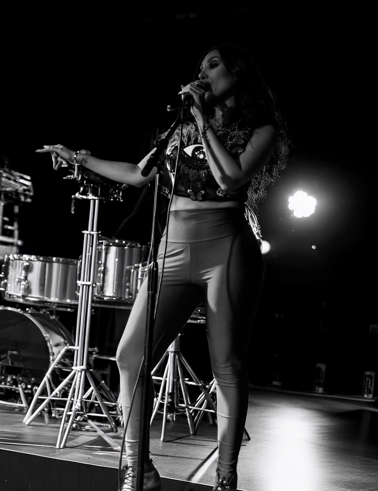 Jada Davino performing live on stage with her band